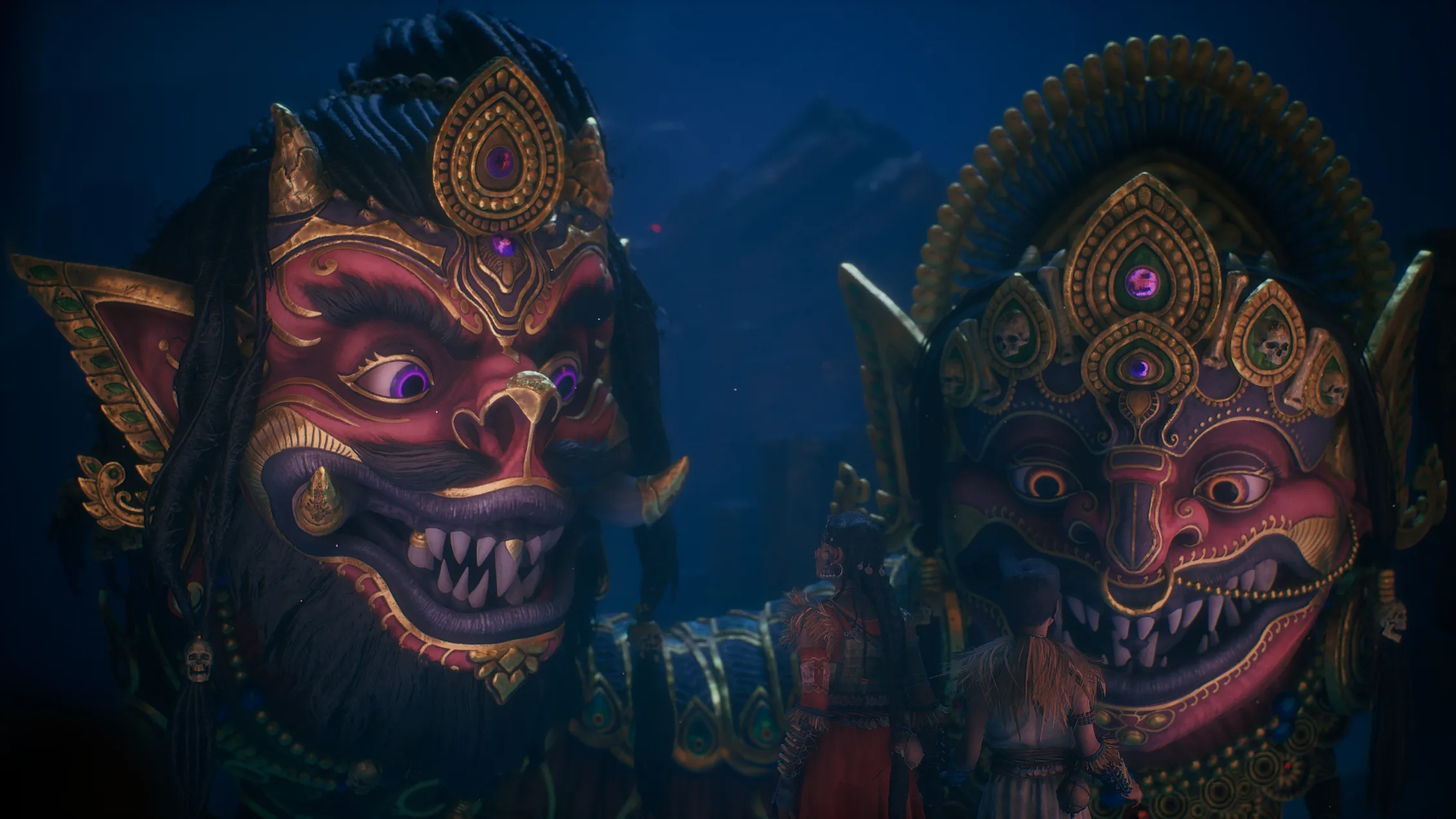A rendered scene in deep blue: two giant carved masks with bared teeth, painted red and gold under jewelled crowns, fill the frame left and right. Between them, small against the masks, two figures stand with their backs turned, looking up.